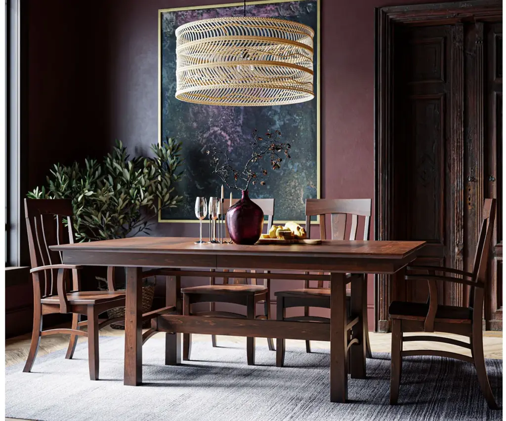 Solid wood dining room furniture with table, chairs, and bench in moody dining room
