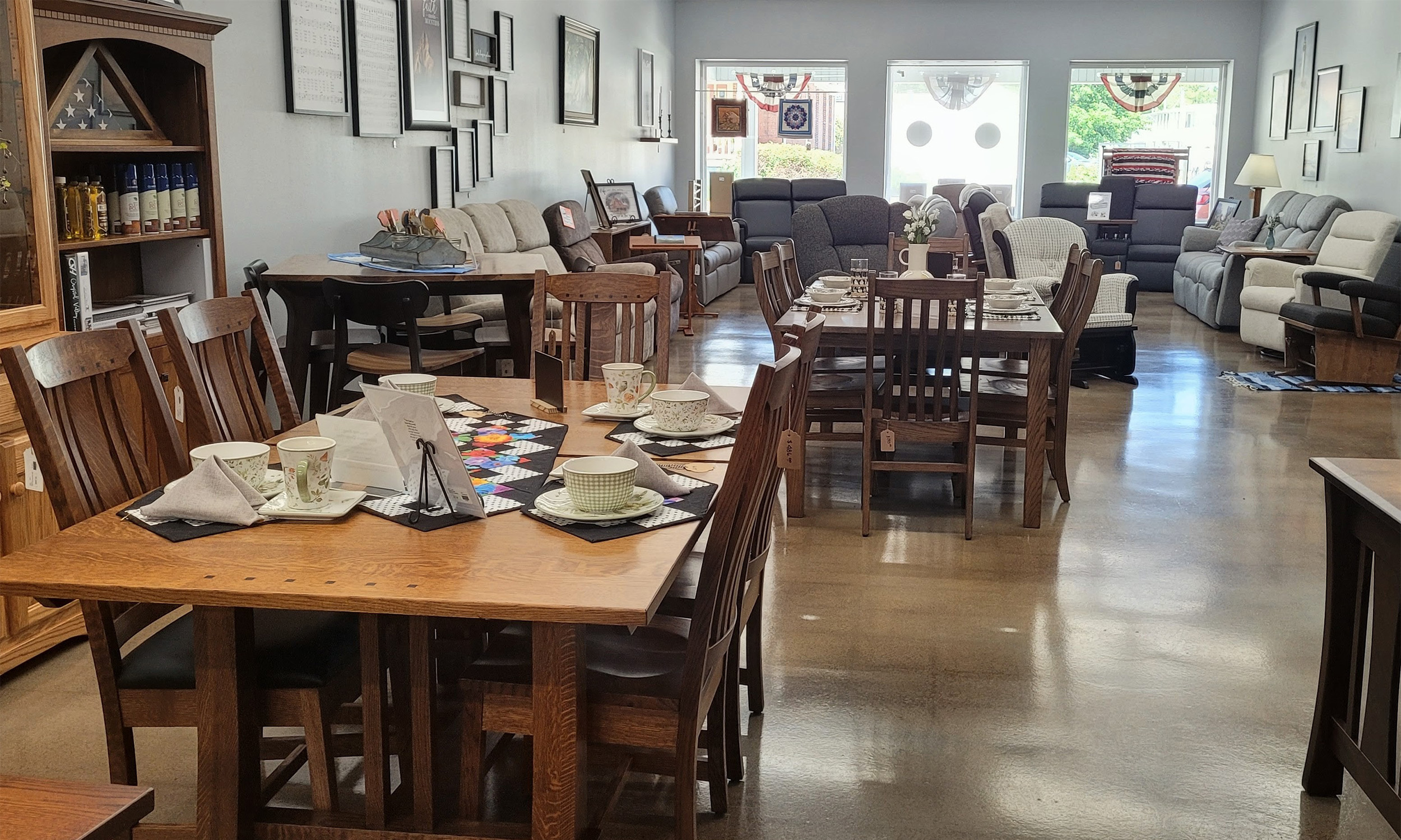 Amish furniture showroom with solid wood dining tables, chairs, and living room seating